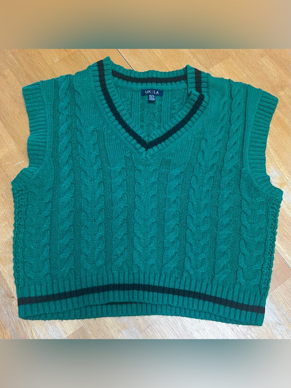UK2LA Emerald Green V-Neck Sweater Vest with Black Trim, size XS, is oversized